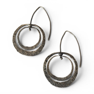 Sterling Silver Loop Earrings designed by Deb Collins, showcasing unique organic shapes inspired by nature and crafted with traditional metalsmithing techniques.