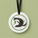 Decorative pendant with a seal
 design on a white background