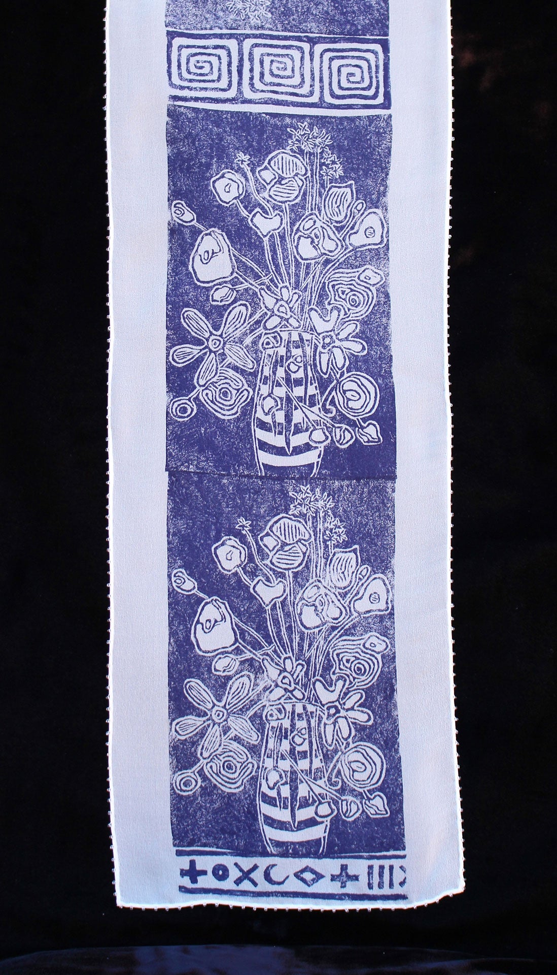 Flowers in a Vase Scarf by Jody Bare featuring a unique lino-cut block print design in blue and white, showcasing a floral arrangement in a vase, perfect for adding a touch of elegance to any outfit.