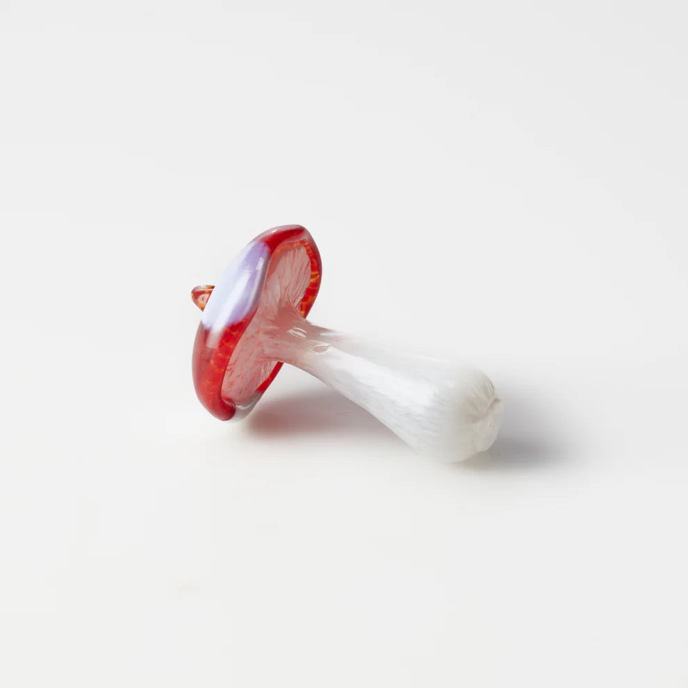 Decorative mushroom ornament with red cap and white stem 