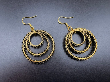 Breeze Chic | Golden Orbit handcrafted paper quilling artwork featuring an intricate golden heart design