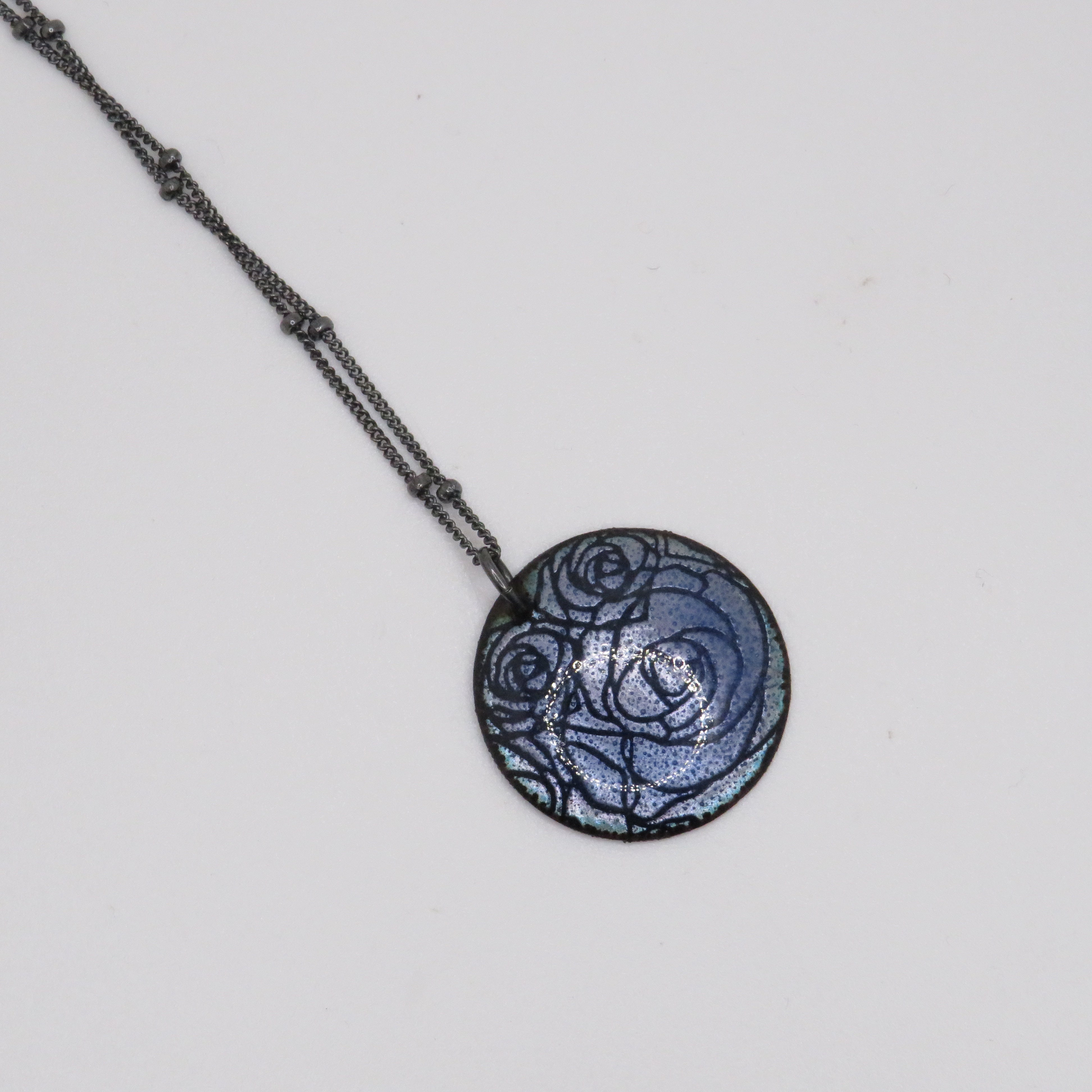 blue pendant necklace with roses