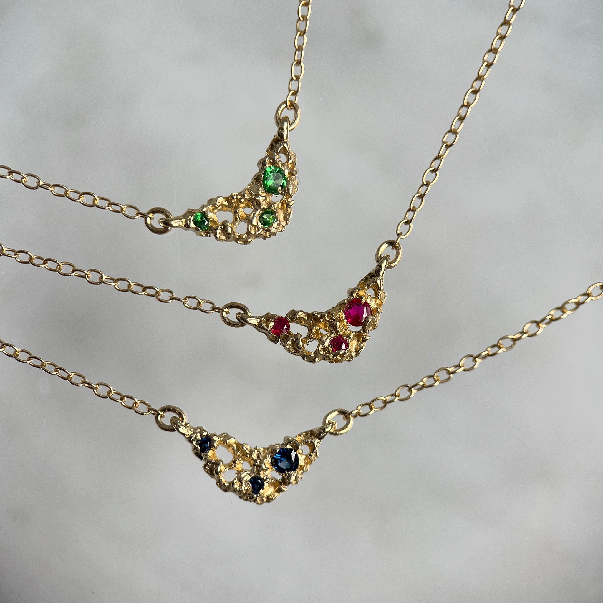 gold necklace with stones