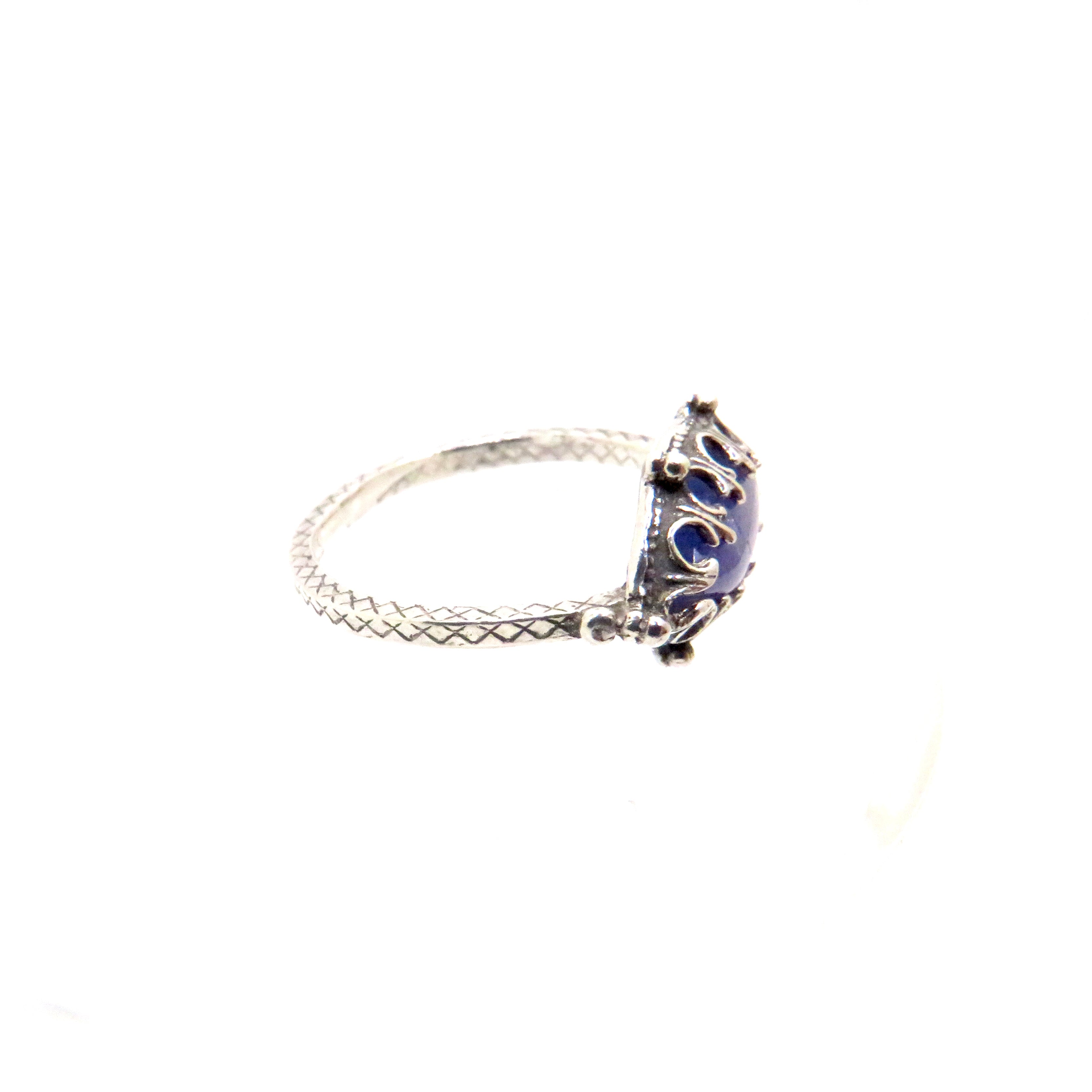 silver ring with blue gemstone