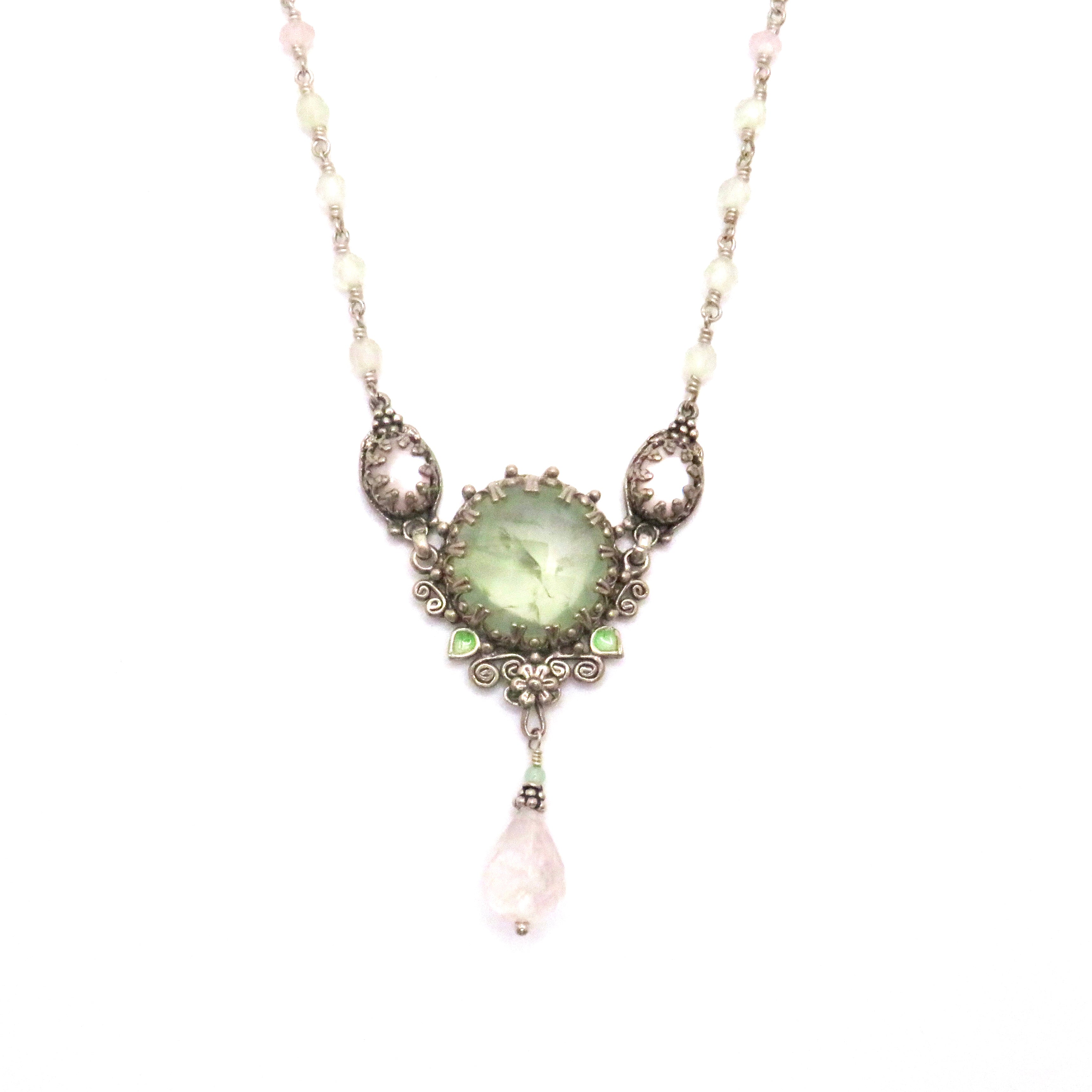 silver necklace with green gemstones and beads