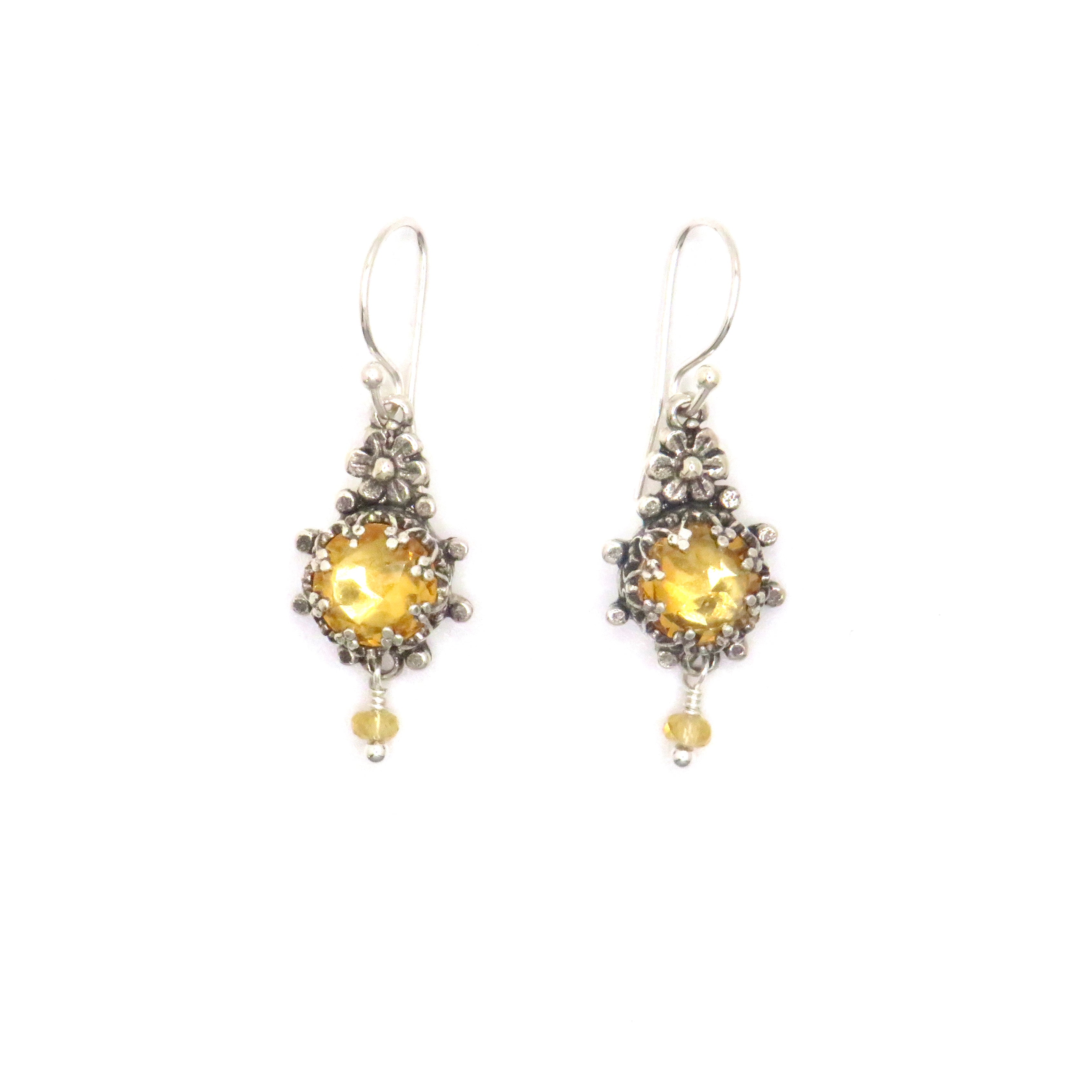silver earrings with yellow gemstone