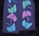 Ginko Fall Scarf by Jody Bare, a luxurious 100% silk accessory adorned with vibrant sapphire and gold prints on a white beaded chiffon, perfect for transforming any dull outfit into a chic statement that says 'Yes, I do brunch in style.'