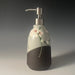 clay lotion dispenser with painted flowers