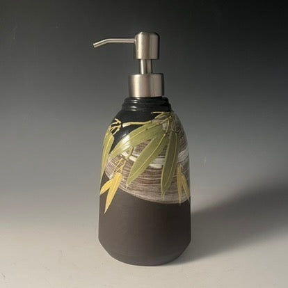 clay lotion dispenser with painted leaves