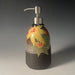 clay lotion dispenser with painted fall leaves