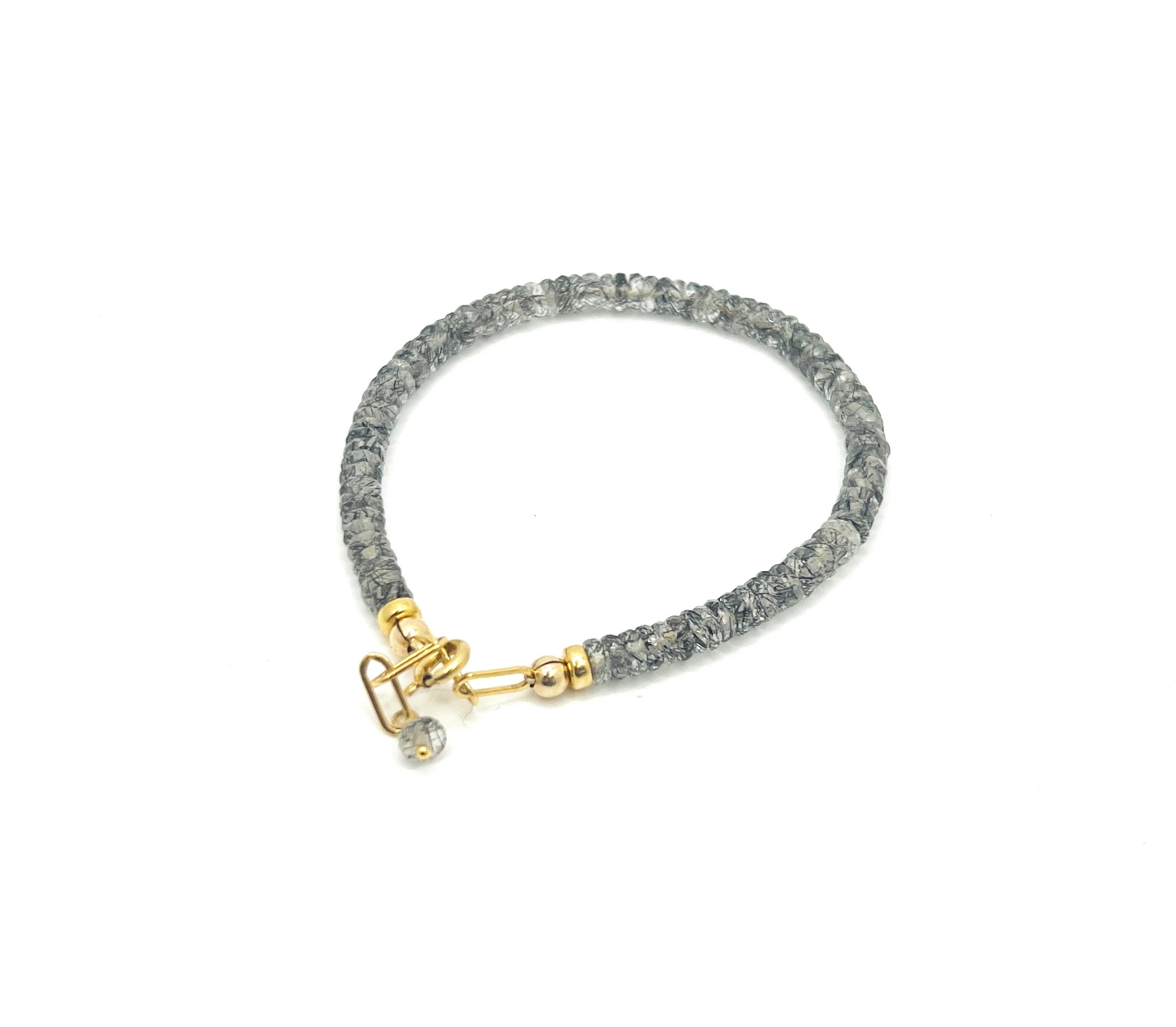 Heishi Patchwork Bracelets by Lily Hudson are like a colorful party for your wrist, featuring a dazzling mix of citrine, purple garnet, spinel, and more, that says 'I’m fabulous, and I know it!'
