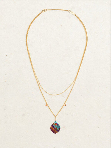 gold necklace with floral and stone