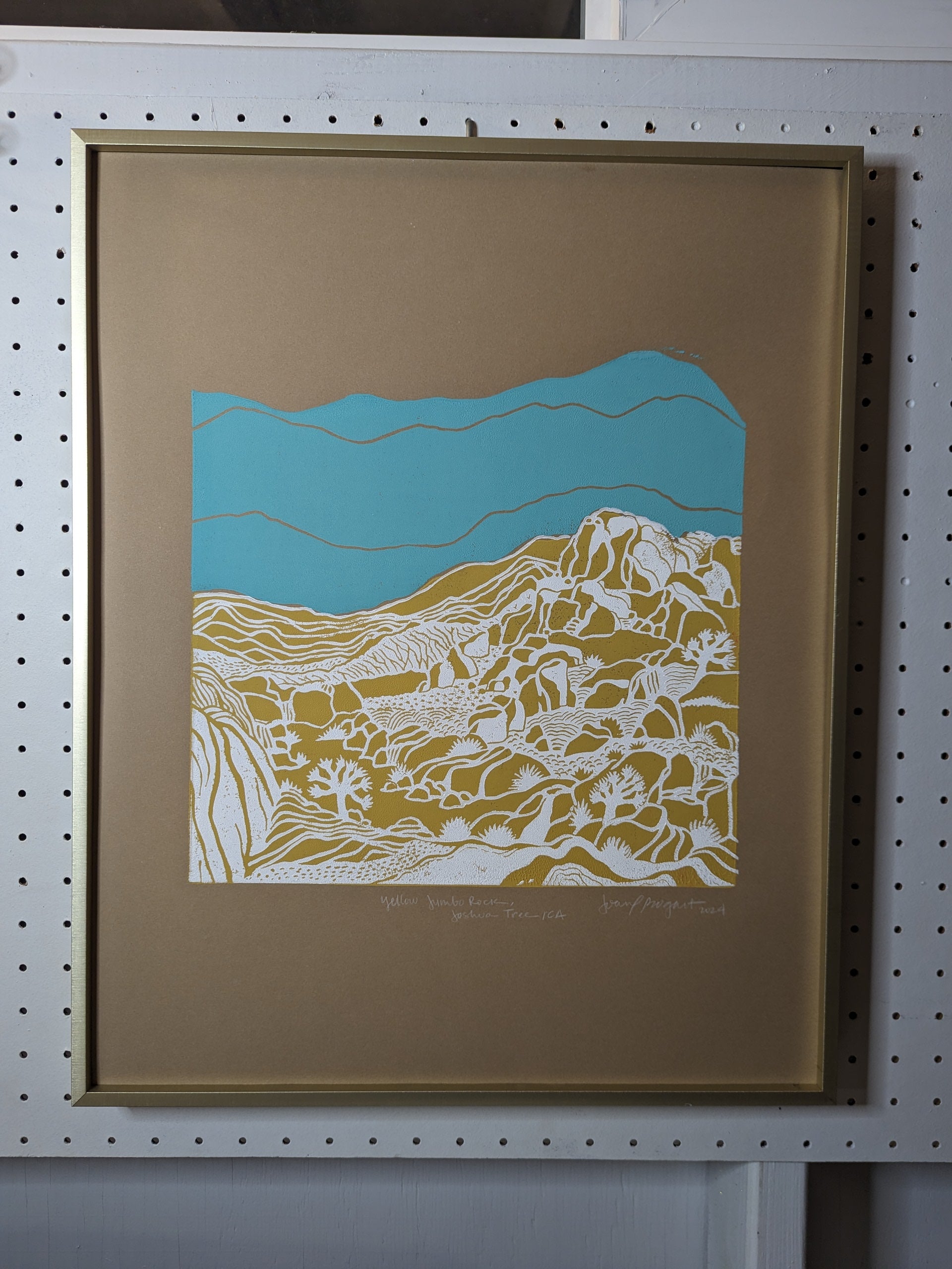 large rock print in gold frame