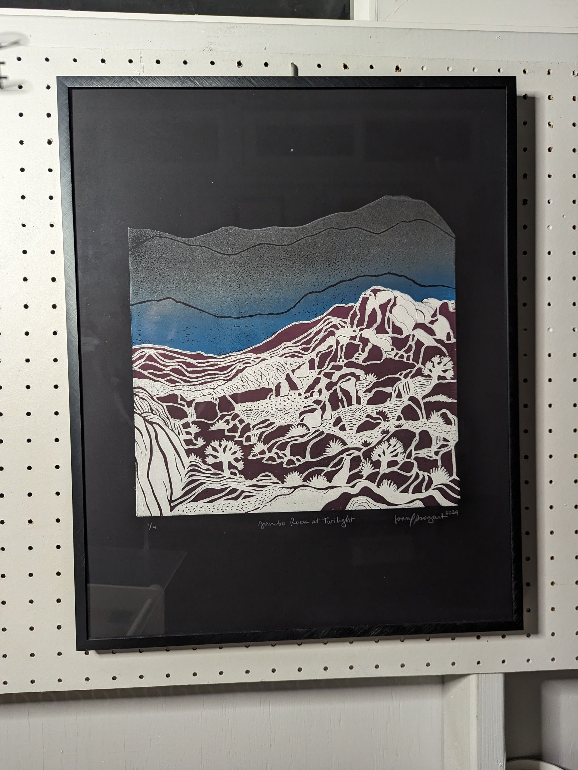 large rock print in black frame
