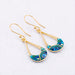 Show off your style with 18K Gold Plate Crystal Long Drop Hoop Earrings - because who needs a crown when you have these?