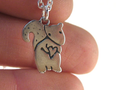 squirrel with heart necklace
