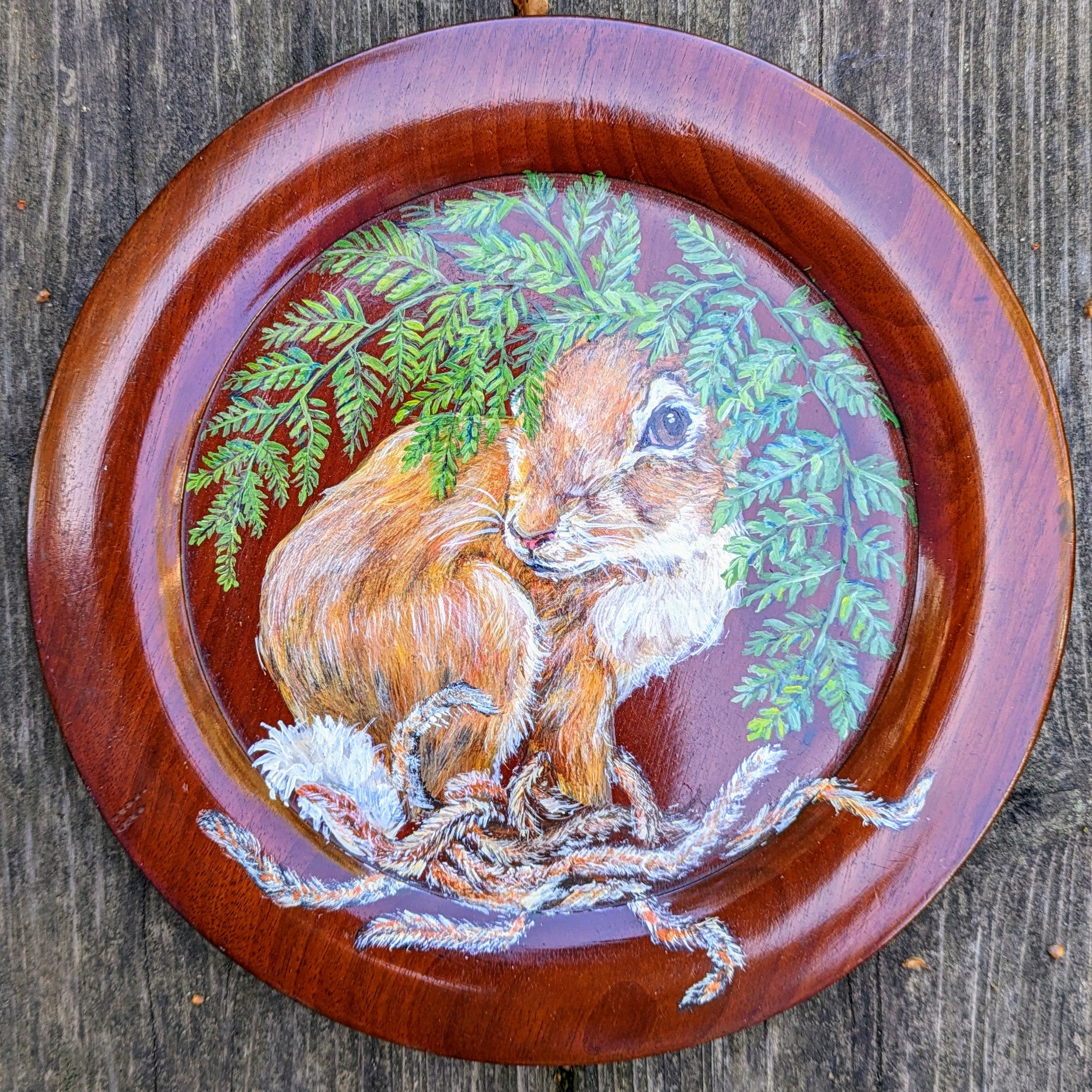 rabbit painting on wood plate