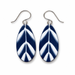 A pair of teardrop-shaped drop earrings with a navy blue and white leaf pattern, suspended from silver fishhook wires on a plain white background.