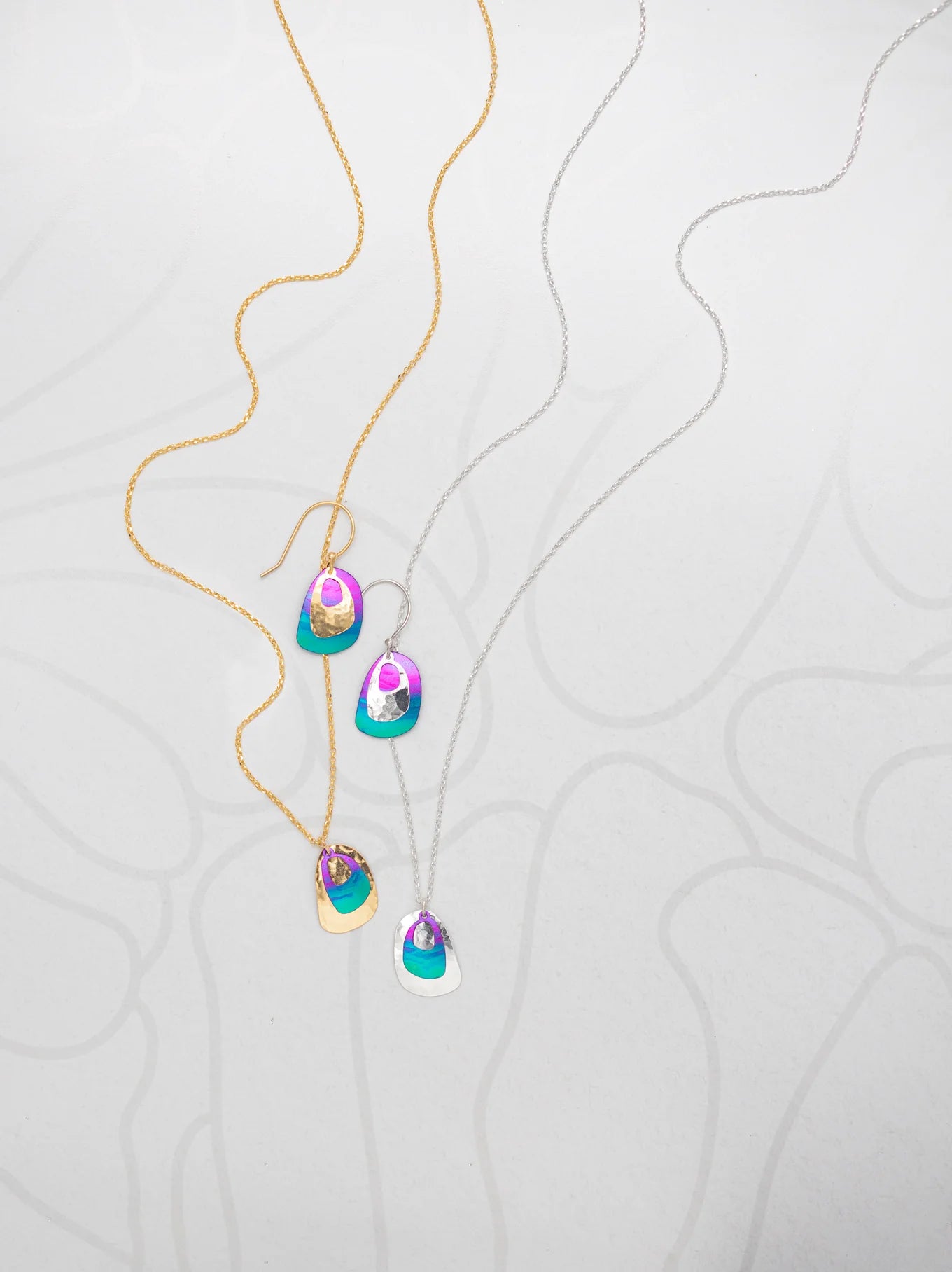 multi-colored hammered drop earrings and pendant necklace