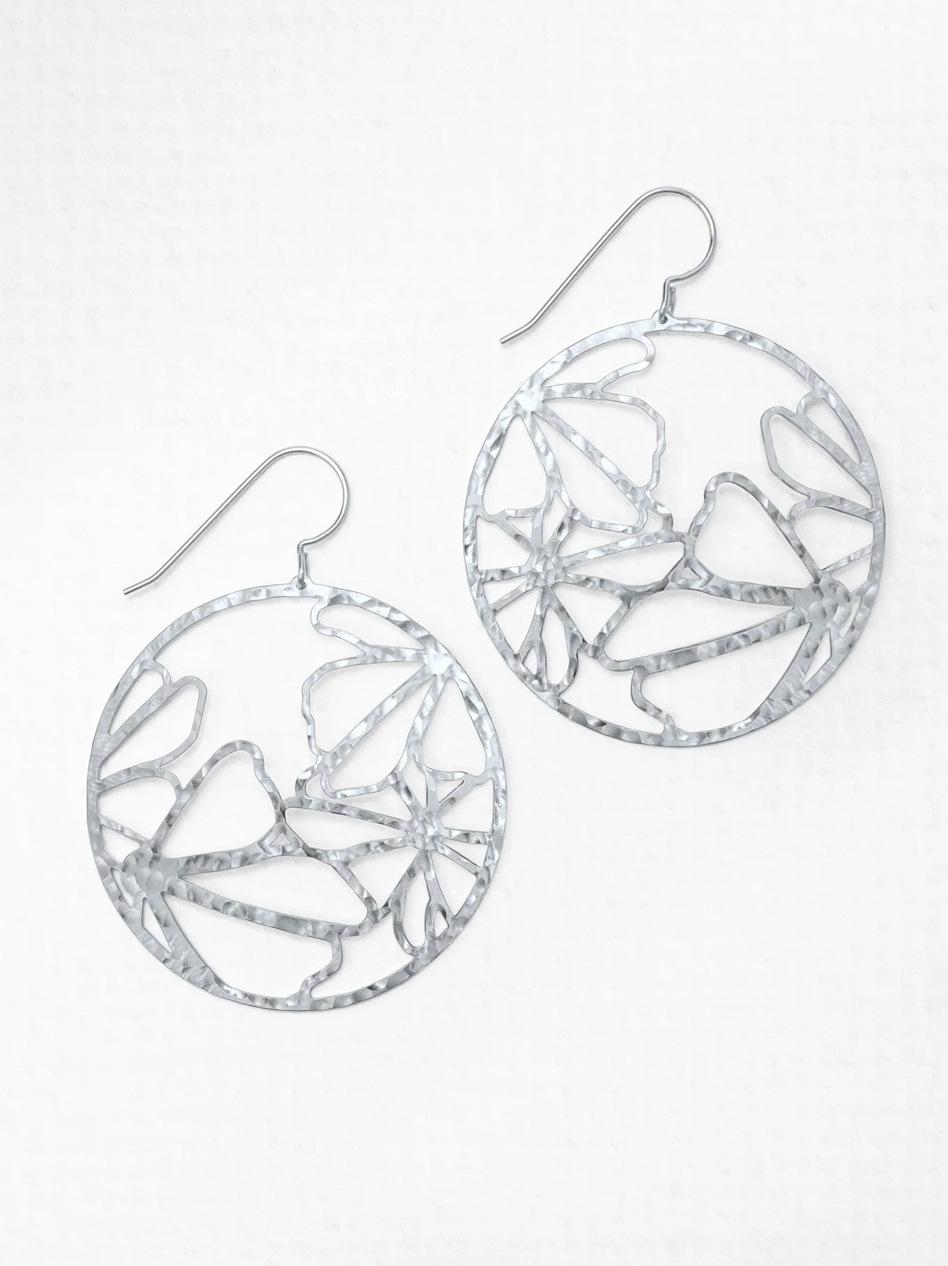 round silver hammered earrings with flowers
