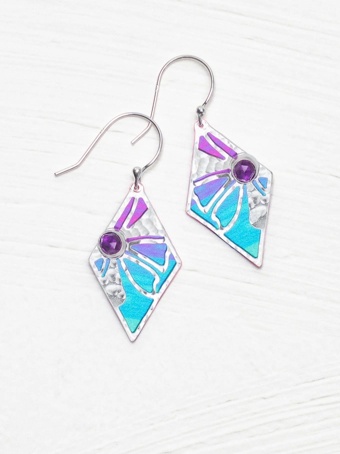 silver earrings with purple gemstone