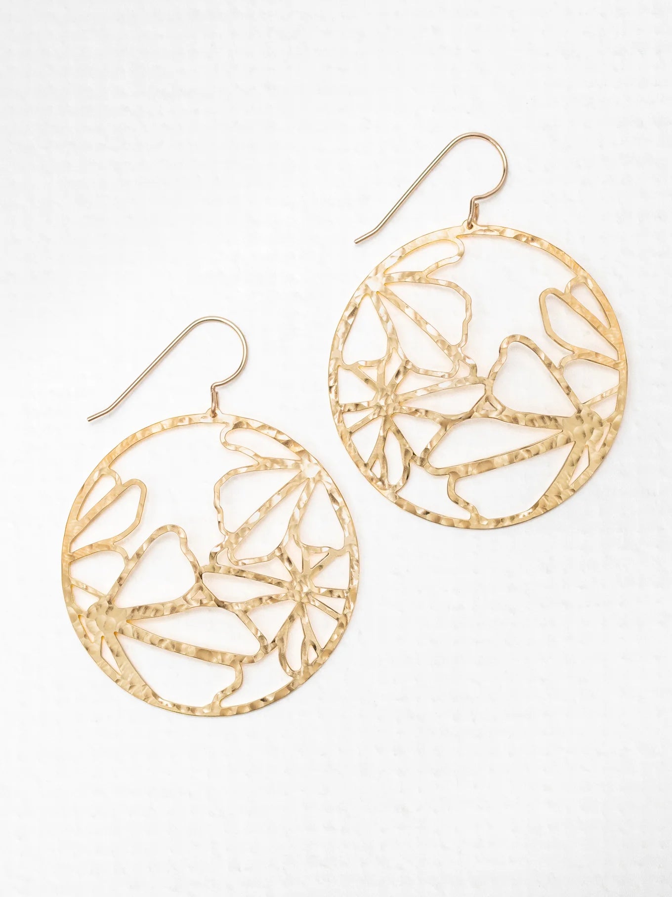 round gold hammered earrings with flowers