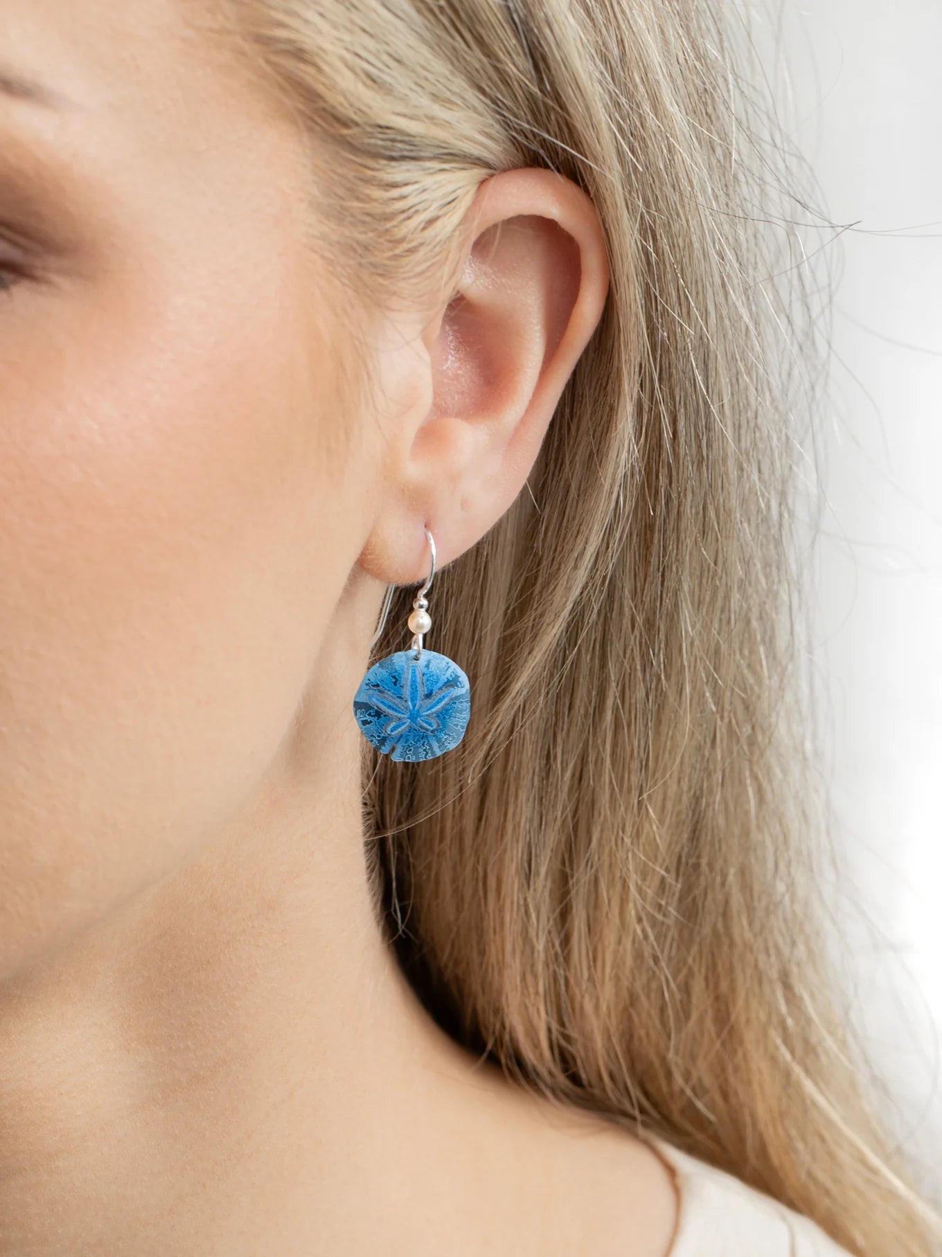 blue sand dollar etched drop earring with pearl