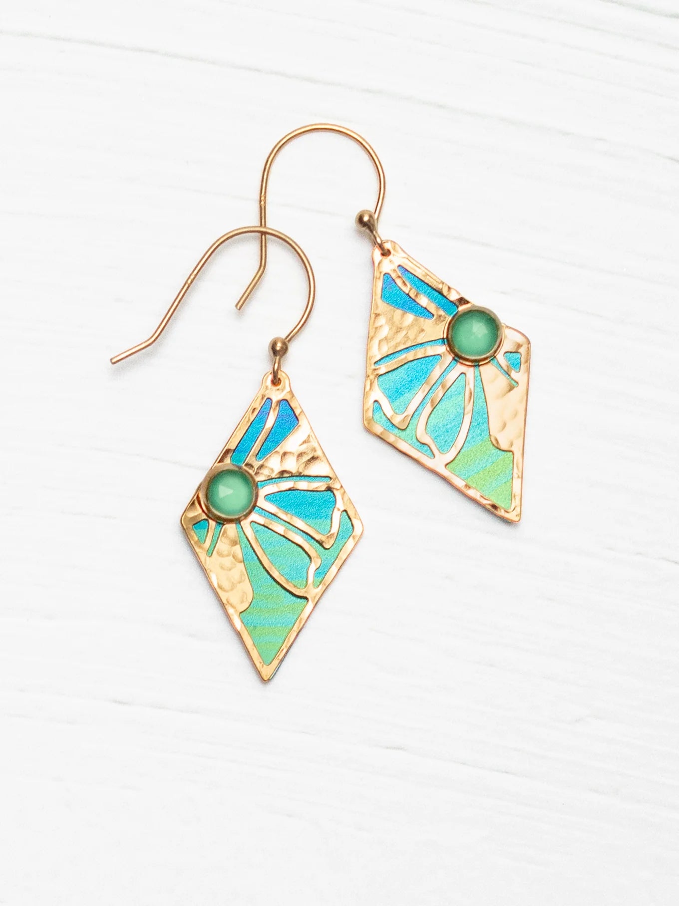 gold earrings with gemstone