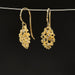 Gold clustered drop earrings with intricate design and gemstones