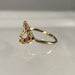 Gold clustered ring with red gemstones 