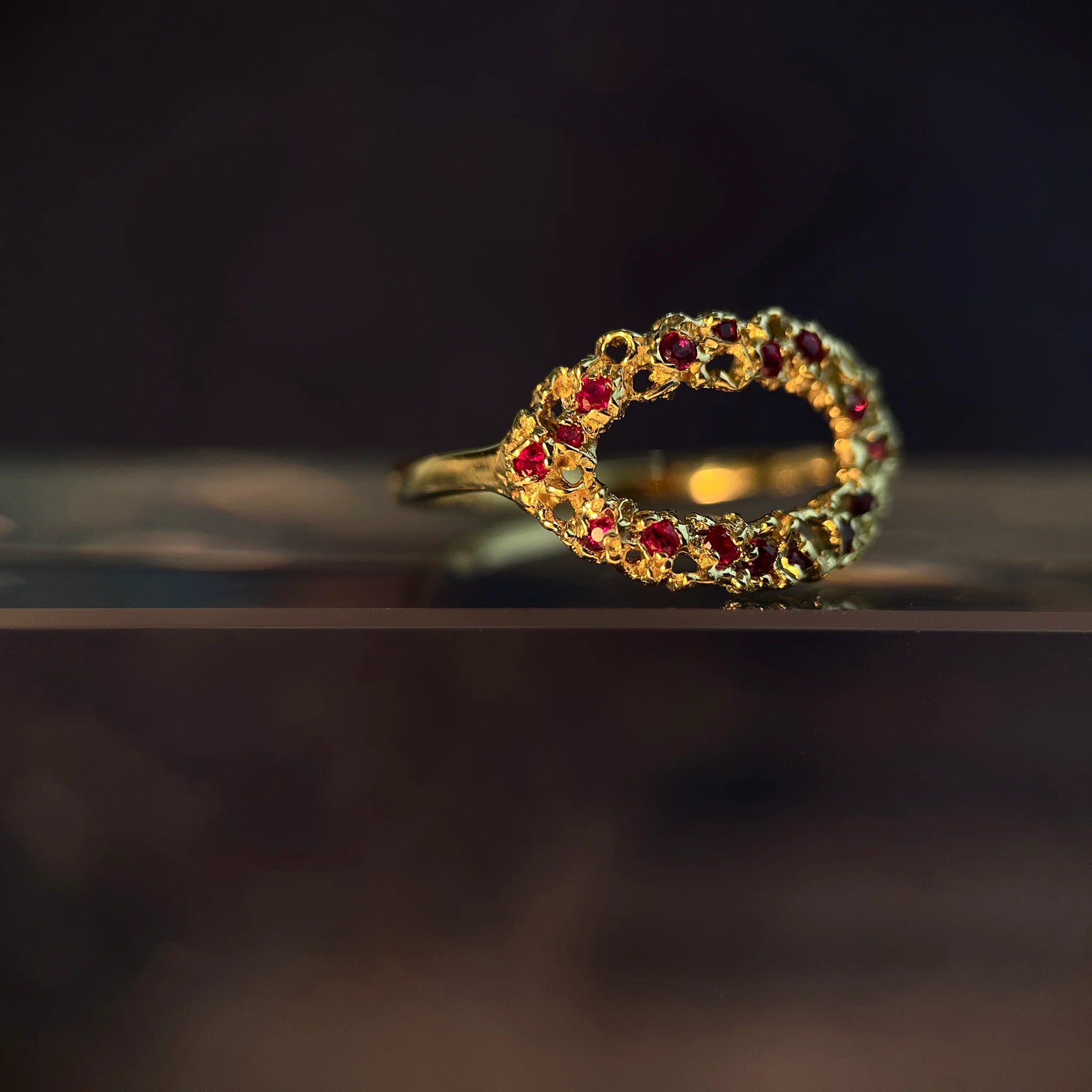 Gold clustered ring with red gemstones 
