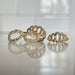 Four gold rings with gemstones 