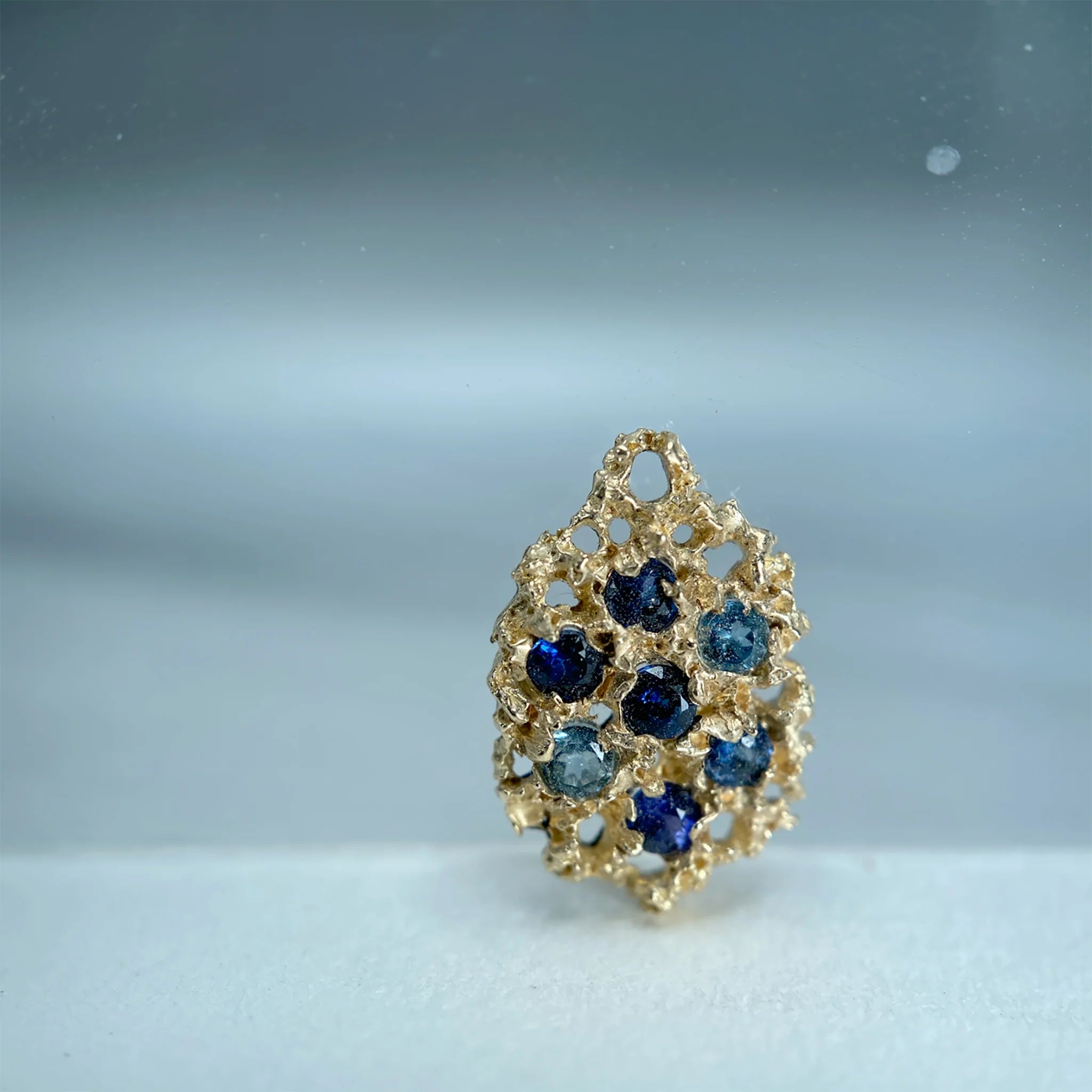 Gold cluster with blue gemstones
