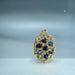 Gold cluster with blue gemstones