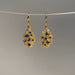 Gold drop clustered earrings with blue stones