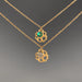 Two gold necklaces with floral pendants and gemstones