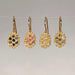 Four pairs of gold clustered earrings with gemstones 