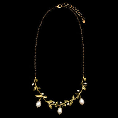gold leaf necklace with pearls.