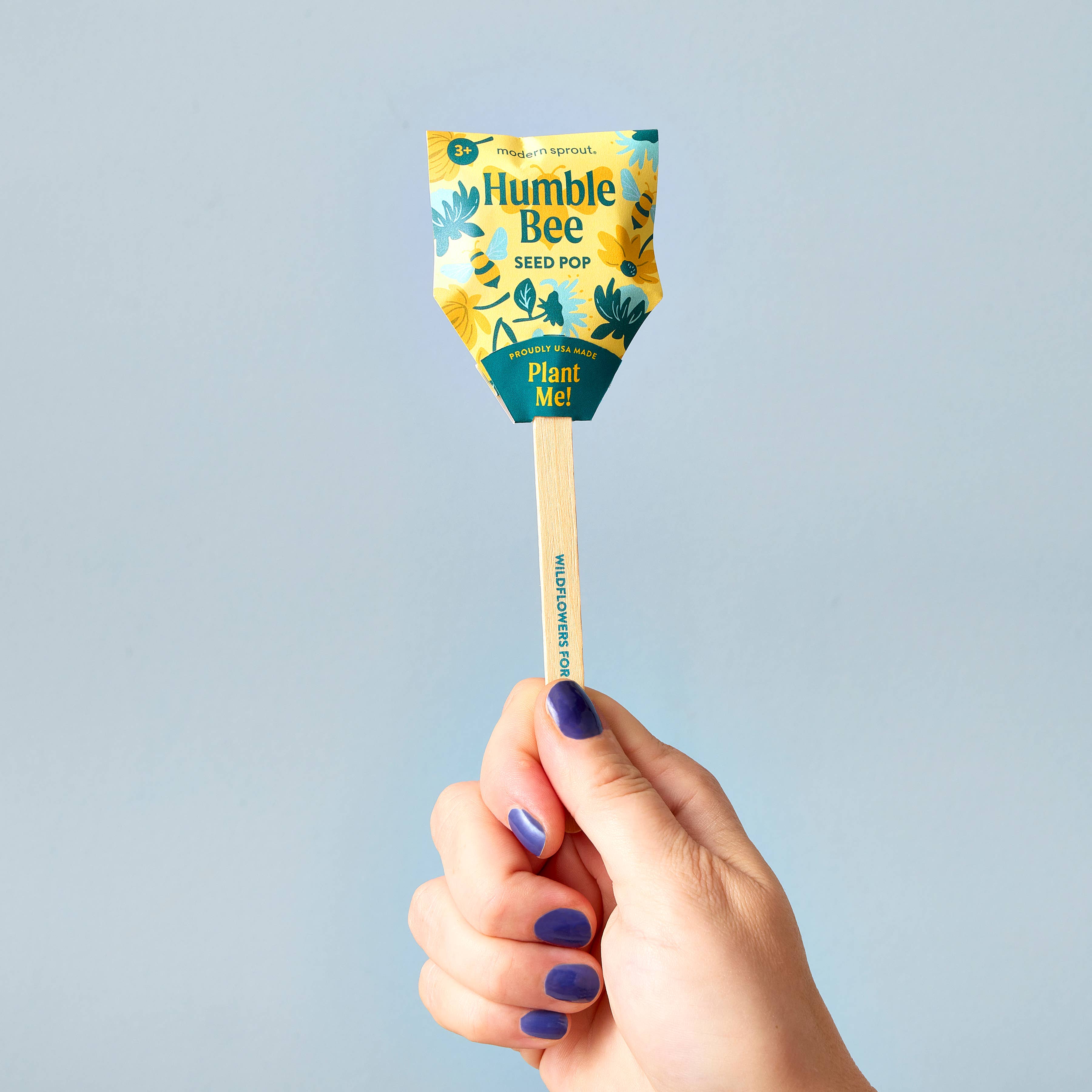 A close-up of the Humble Bee seed pop by Modern Sprout, with eye-catching design and a wooden stick indicating 'Plant Me'.