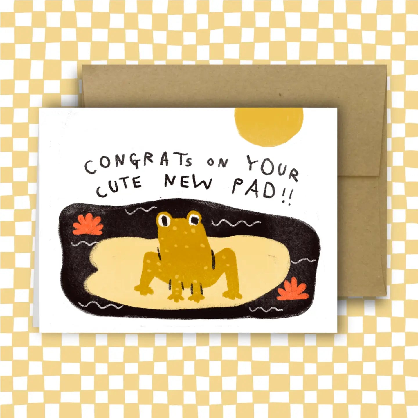 Greeting card with a frog illustration and text 'Congrats on your cute new pad'
