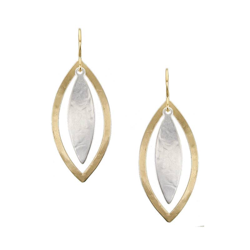 Leaf and Frame Wire Earrings by Marjorie Baer featuring a hammered brass leaf frame with a silver leaf on top, showcasing a botanical design that embodies nature-inspired whimsy.