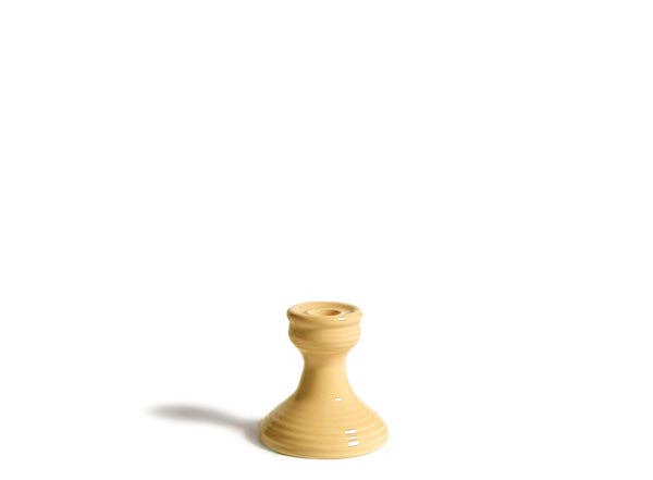 yellow candlestick holder