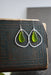 Handmade Green Eco Glass Teardrop Frame Earrings featuring sustainable materials and sterling silver ear hooks.