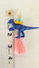 dinosaur drop earrings with pink tassel