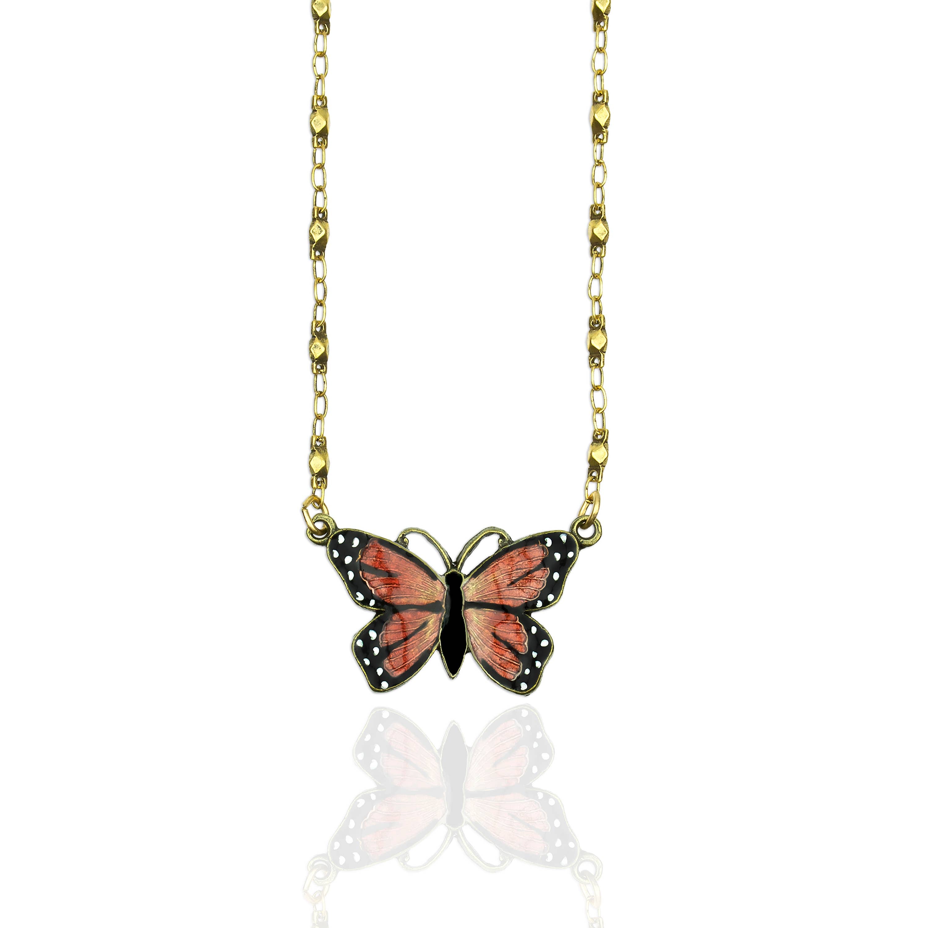 Beautiful Halidae Monarch Butterfly Necklace by Anne Koplik Designs, featuring a hand-enamelled Monarch butterfly in vibrant orange and black on an antiqued brass chain, symbolizing endurance, change, and hope.