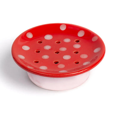 Red ceramic soap dish with white polka dots, designed by Kalastyle Soap Co., featuring drainage holes and a whimsical mushroom design; part of the Swedish Dream Mushroom Ceramic Soap Dish collection.