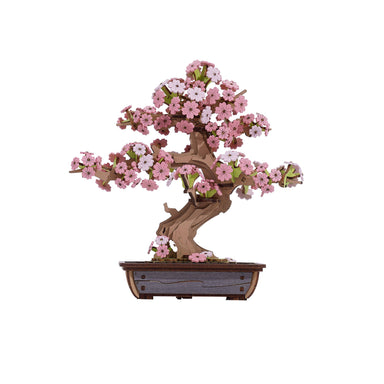 Sakura Bonsai Modern Wooden Puzzle by Hands Craft, showcasing a beautifully detailed 3D wooden puzzle of a cherry blossom bonsai tree with pink flowers against a white background.