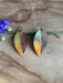 Botanical Large Leaf Fire Painted Copper Earrings styled with a fashion accessory, emphasizing copper's beauty and symbolic meaning.