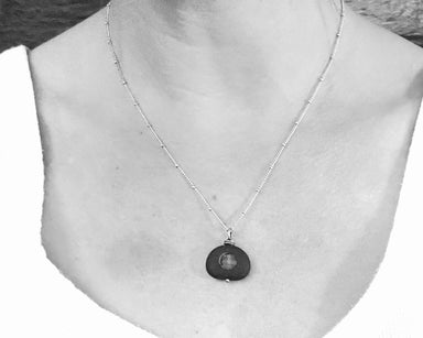 Alternate view of Black and Silver Ice Stack by Suzanna Garrett Designs — a river stone becomes the frame for a tiny stack of sea glass in this beautifully unexpected pendant