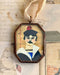 Vintage-style salty sailor art locket ornament.